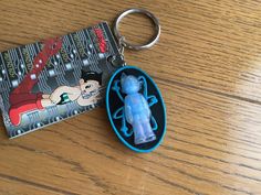 a keychain with an image of a cartoon character on it