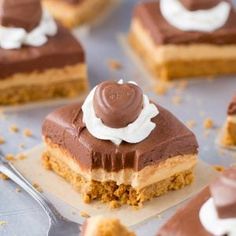 several pieces of cake with chocolate frosting and whipped cream on top