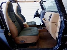 the interior of a vehicle with leather seats