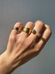 Elevate your style with our exquisite collection of gold stacking rings, exclusively available at Christina Christi Store. Crafted to perfection, this set features a medium-width ring with engraved edges, a mesmerizing evil eye design on the middle ring, and a uniquely stunning ring with two spheres at the edges. Each ring is slightly adjustable for a comfortable fit on any finger. With a diameter of 17mm (0.67'') or US size 7, these rings are versatile for any occasion. Please note that each ri Gold Rings Band, Stackable Rings Gold, Stacking Rings Gold, Rings Stacking, Gold Stacking Rings, Evil Eye Design, Gold Rings Stackable, Gold Ring Stack, Gold Band Ring