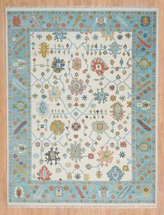 a blue and white rug with various designs on it