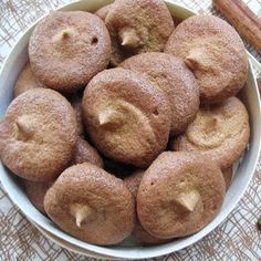 cinnamon sugar cookies in a bowl with cinnamon sticks