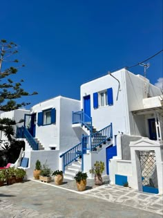 a white and blue building with steps leading up to it