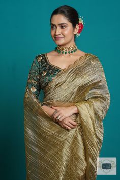 1.Fabric: Zari Tissue 2.Work: The saree borders have been scalloped using fine cutdana beads and zari. 3.Colour: Ash Green 4.Length: 5.5 metre Width: 43 inches approx 5.Blouse piece: Unstitched Colour: Emerald Green Fabric: Crepe Silk Length: 1 metre Work: embroidered heavily on the front,back and sleeves using colourful sequins,pearls and cutdana in floral pattern. Swipe for picture. 6.Care: DRY WASH ONLY. NEVER WASH EMBROIDERED FABRICS. 7.Despatch Time: 12-15 days. What You will Recieve: 1 Sar Emerald Green Saree Silk, Cocktail Saree, Emerald Green Fabric, Saree Borders, Emerald Green Blouse, Golden Saree, Tissue Saree, Saree Border, Satin Saree