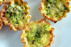 broccoli and cheese cups on a white plate