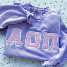 This trendy & unique Basic Comfort Colors Greek Letter Crewneck Sweatshirt is sure to stand out on any campus! Grab one for you, your big/little, or a group of sisters Picture Details Pictures (left to right): ⭑ #1-2: Blue Spruce sweatshirt, White top fabric, Dark Green background fabric (models wearing size large) ⭑ #3: Grey sweatshirt, Light Pink top fabric, White background fabric, White sweatshirt, Light Pink top fabric, White background fabric ⭑ #4: Grey sweatshirt, Light Pink top fabric, W White Glitter Background, Light Pink Top, Light Pink Tops