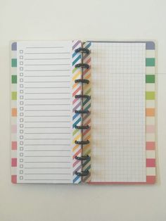 an open notebook with colorful lines on it