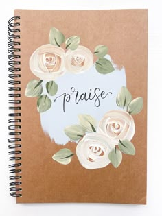 a spiral notebook with flowers and the words praise written on it