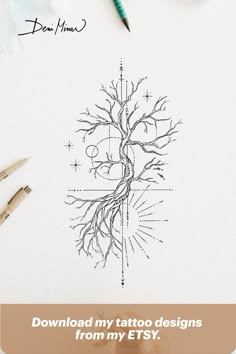 a person holding a pen and drawing a tree on top of a sheet of paper