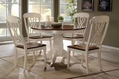 a dining room table with chairs around it