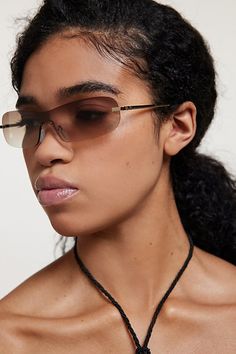 Iconic Y2K sunglasses in with a rimless silhouette complete with sunset-fade lenses. Features Y2K micro rimless sunglasses Retro sunglasses Lightweight rimless frames UV protection Content + Care Plastic, mixed metal Wipe clean Imported | Y2K Micro Rimless Sunglasses in Brown, Women's at Urban Outfitters Rimless Shield Sunglasses With Gradient Lenses, Shop Y2k, Iconic Y2k, Y2k Sunglasses, Rimless Frames, Sunglasses Retro, Brown Fits, Rimless Sunglasses, Retro Sunglasses