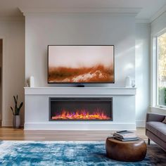 a living room with a large television mounted on the wall and a fire place in front of it