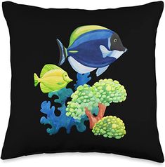 a black pillow with blue and yellow fish on it