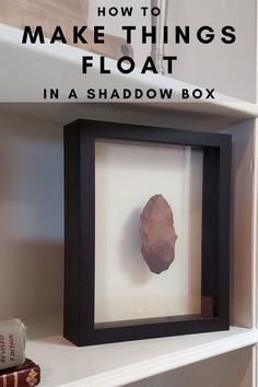 a shadow box with a rock in it and the text how to make things float in a shadow box