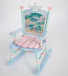 Queen Of The Sea Children's Rocker Chair  Sea Life Theme on Back with "Queen of the Sea" and a Tiara  Pastel colored painted wood  Pink Seat Cushion in a Scallop Shell Shape 28" H x 23" L x 16" W  Rare Discontinued Item  Needs Assembly  Ages 3 - 6 years New in Box Queen Of The Sea, Sea Life Theme, Upcycle Chair, Kids Rocker, Kids Rocking Chair, Childrens Rocking Chairs, Magical Mermaid, Rocker Chair, Wood Rocking Chair