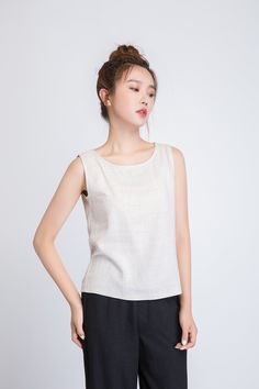 "It's called EveryWear because you can wear this linen tank top... well, everywhere. And we mean everywhere. At the office, happy hour, first dates, second dates, picnics, parties, BBQs, running errands, running 5Ks. You get the idea. DETAILS * 50% linen , 50% cotton blend * Scoop neckline * No zipper * Loose fit * Summer Tank top * Wash by hand or machine with cold water, Ironing after dry * Size Guide https://www.etsy.com/listing/722950722 * SIZE CHART https://www.etsy.com/listing/736810337 * Casual Flax Linen Tank Top, Casual Sleeveless Flax Tank Top, Beige Linen Sleeveless Blouse, Beige Sleeveless Linen Top, Beige Ramie Top For Summer, Beige Ramie Summer Top, Summer Beige Ramie Tops, Casual Linen Sleeveless Blouse Tank Top, Beige Linen Sleeveless Tank Top