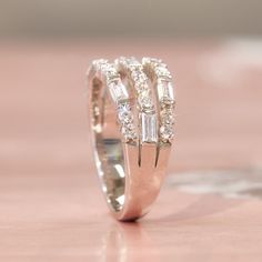 Ring stacking made real easy. Let the Tessa Ring do the work for you with the illusion of stacked rings. 💖 Classy Fashionista's No.1 choice Double Sparkling Everyday Everywhere * 3-layer Heavy Platinum plating over Sterling Silver * Top Grade 5A Cubic Zirconia Diamond Alternatives * Quality that is indistinguishable from a real diamond ring 👍 Recommendations * As a travel wedding band * At parties * When celebrating anniversaries and making a meaningful gift * It's perfect for when you don't w Luxury Diamond Stackable Rings With Three Stones, Cheap Sterling Silver Stackable Rings For Anniversary, Luxury Diamond Dazzling Stackable Rings, Affordable Sterling Silver Stackable Engagement Rings, Luxury Multi-stone Rings For Anniversary, Luxury Elegant Stackable Rings With Pave Setting, Luxury Platinum Stackable Rings Fine Jewelry, Luxury Three Stone Stackable Rings For Anniversary, Luxury Three Stone Stackable Rings For Women