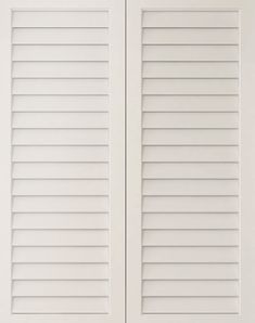 two white doors with shutters on each side