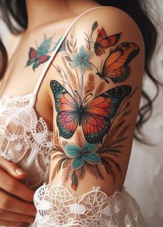 a woman's arm with butterflies on it and laces around her waist,