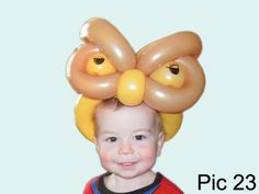 a young boy with an inflatable bow on his head