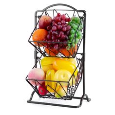 a metal basket filled with fruit on top of a white background