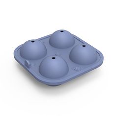 an ice tray with four balls in it on a white background, 3d rendering image