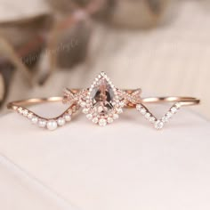 a close up of a ring on a white surface with other items in the background