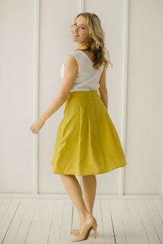 "Yellow Linen Skirt, Linen Retro Skirt, Linen Pleated Skirt Every item is handmade to order and to your personal body measurements (made to measure). DESCRIPTION: -High Waist -Pleats from the waist down -Pockets -Mid Length -Handcrafted Color in the picture- spring yellow and green grey. Other colors are available. ETHICALLY MADE. Every linen garment is handmade using the body measurements of the individual customer. No factory use. Every creative and sewing task is fairly rewarded. Material: 10 Elegant Yellow Pleated Skirt, Fitted Yellow Gathered Skirt, Relaxed Knee-length Gathered Skirt, Fitted Yellow Wrap Skirt, Yellow Flowy Full Skirt, Yellow Full Flowy Skirt, Yellow Knee-length Pencil Skirt, Elegant Yellow Pleated Bottoms, Elegant Yellow Skirt