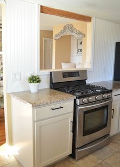 a stove top oven sitting inside of a kitchen next to a sink and countertop