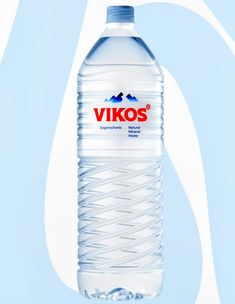 a large bottle of water sitting on top of a blue background with white swirls