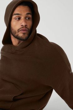 Softest. Hoodie. Ever! Made from ultra-cozy knitted cotton yarn, the Scholar Hooded Sweater is a 10/10. It’s warming yet breathable with classic features like a kangaroo front pocket for stashing small essentials and a ribbed hem and cuffs for a snug fit. A built-in hood and dropped shoulders complete the cozy, off-duty vibe. Pair it with any super-soft sweats in your closet and wear on repeat. Ultra-cozy knitted cotton yarn Built-in hood & kangaroo front pocket Unisex style Designed & uniquely Athleisure Hoodie For Cold Weather And Fall, Alo Yoga Sweater For Winter Loungewear, Alo Yoga Sweater For Fall Loungewear, Alo Yoga Fall Sweater For Loungewear, Alo Yoga Winter Loungewear Sweater, Winter Athleisure Hoodie For Cold Weather, Modern Cotton Sweater For Winter, Hooded Alo Yoga Outerwear With Ribbed Cuffs, Alo Yoga Hooded Outerwear With Ribbed Cuffs