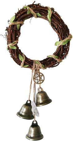 a wreath with two bells hanging from it