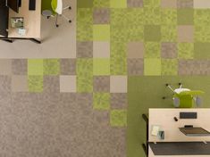 an office area with desks, chairs and a wallpapered pattern on the wall