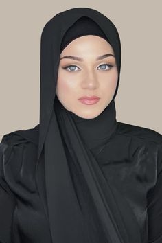 Our Luxury Chiffon Hijab-Black is perfect for every occasion. With the softest chiffon fabric we could find, our Luxury Chiffon will become your go to hijab whether you're going out to a fancy party or keeping it casual, looking beautiful is effortless! Fabric: Polyester Chiffon Dimension: 70" x 27" Contour: Long Rectangle Thickness: Light Texture: Smooth Care: Machine or hand wash in warm water, tumble dry or air dry, iron if needed. Elegant Evening Chiffon Abaya, Modest Fitted Black Abaya, Formal Fitted Black Abaya, Modest Black Abaya For Formal Occasions, Elegant Fitted Black Abaya, Elegant Black Abaya For Formal Occasions, Elegant Black Formal Abaya, Elegant Solid Chiffon Hijab, Elegant Solid Color Chiffon Hijab