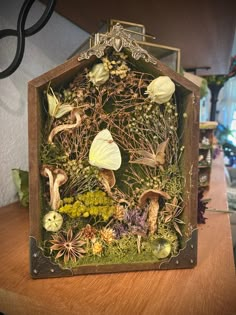 a small house made out of plants and mushrooms