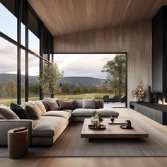 a modern living room with large windows and wood flooring is pictured in this image