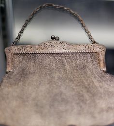 an old purse sitting on top of a table