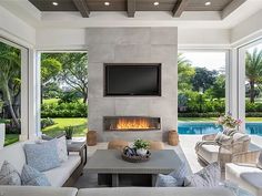 a living room with couches and a fireplace