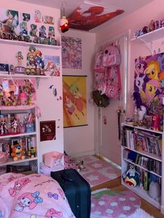 a bedroom with pink walls and lots of toys