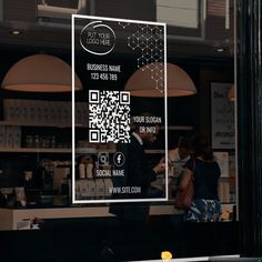 a person standing in front of a store window with a qr code on it