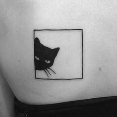 a black and white photo of a cat on the side of a woman's stomach