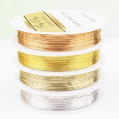 three different types of gold, silver and bronze wire