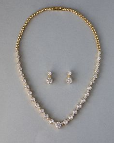 An everyday special occasion necklace style perfect for the bride or any time! Two sizes of brilliant-cut cubic zirconia alternate with small round jewels to create this spin on a classic necklace style! The length of the necklace is 17 inches and the length of the pierced earrings is .75 inches. This set is rhodium, rose gold, or gold plated with grade AAA CZ stones and is lead, cadmium, and nickel free. Elegant Gold Jewelry Set, Modern Indian Jewelry Necklaces, 15 Jewelry Set, Fancy Gold Necklace Set, Elegant Gold Necklace Set, Quinceanera Jewelry Necklaces Gold, Small Stone Earrings Gold, Gold And Diamond Necklace Set, Gold Jewelry With Diamonds