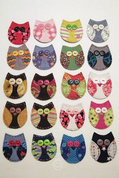 an assortment of owls made out of different fabric materials, including buttons and appliques