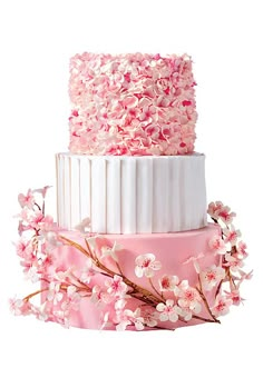 the wedding cake is decorated with pink flowers and white icing on it's side