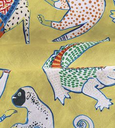 the fabric is very colorful and has different animals on it's side, including an animal - like design