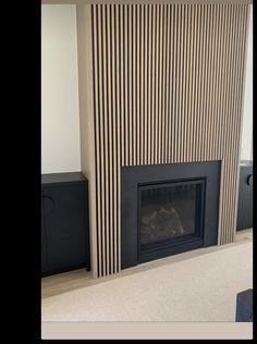 a living room with a fire place and tv on the wall in front of it