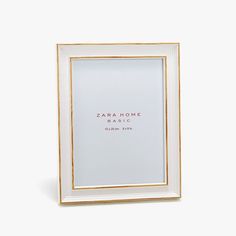 a white and gold frame with the word zara home on it