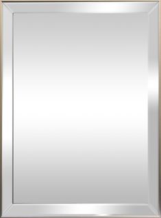 a silver framed mirror on a white wall