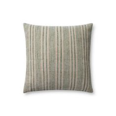 a green and white striped pillow on a white background